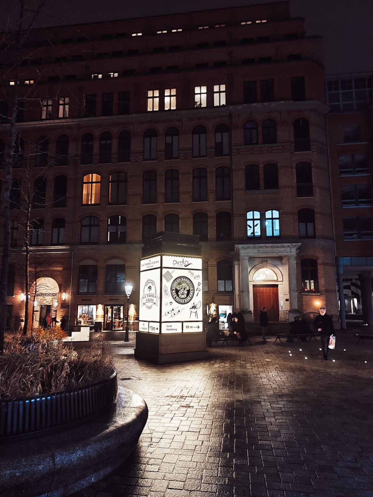 Sign illuminating night street