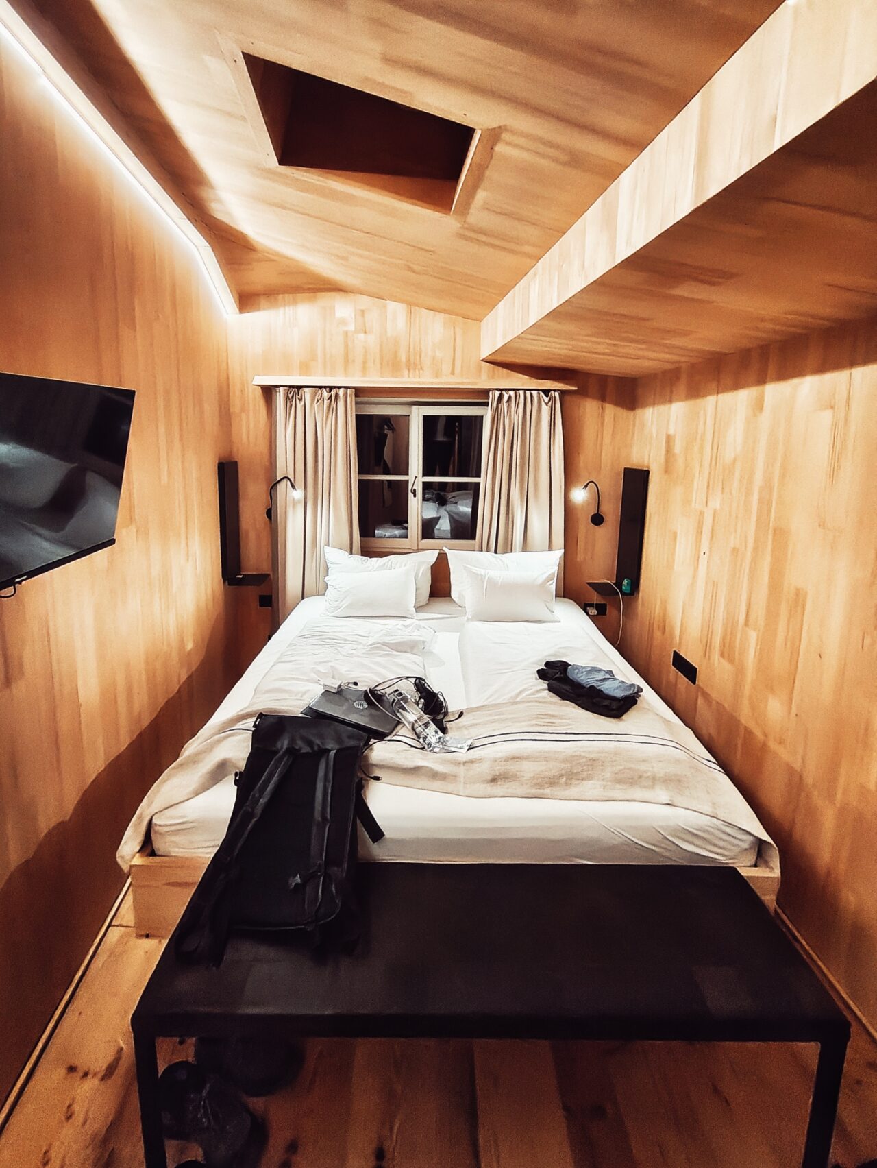 Hotel room with wood paneled walls