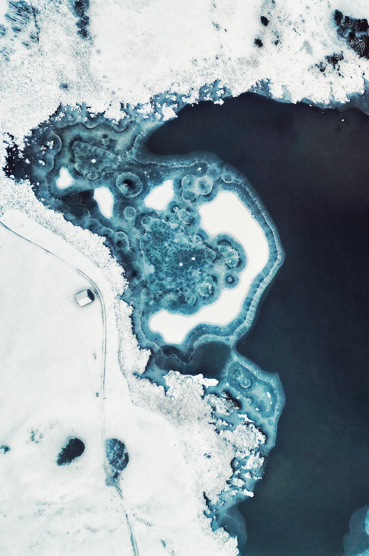 Semi frozen lake from above