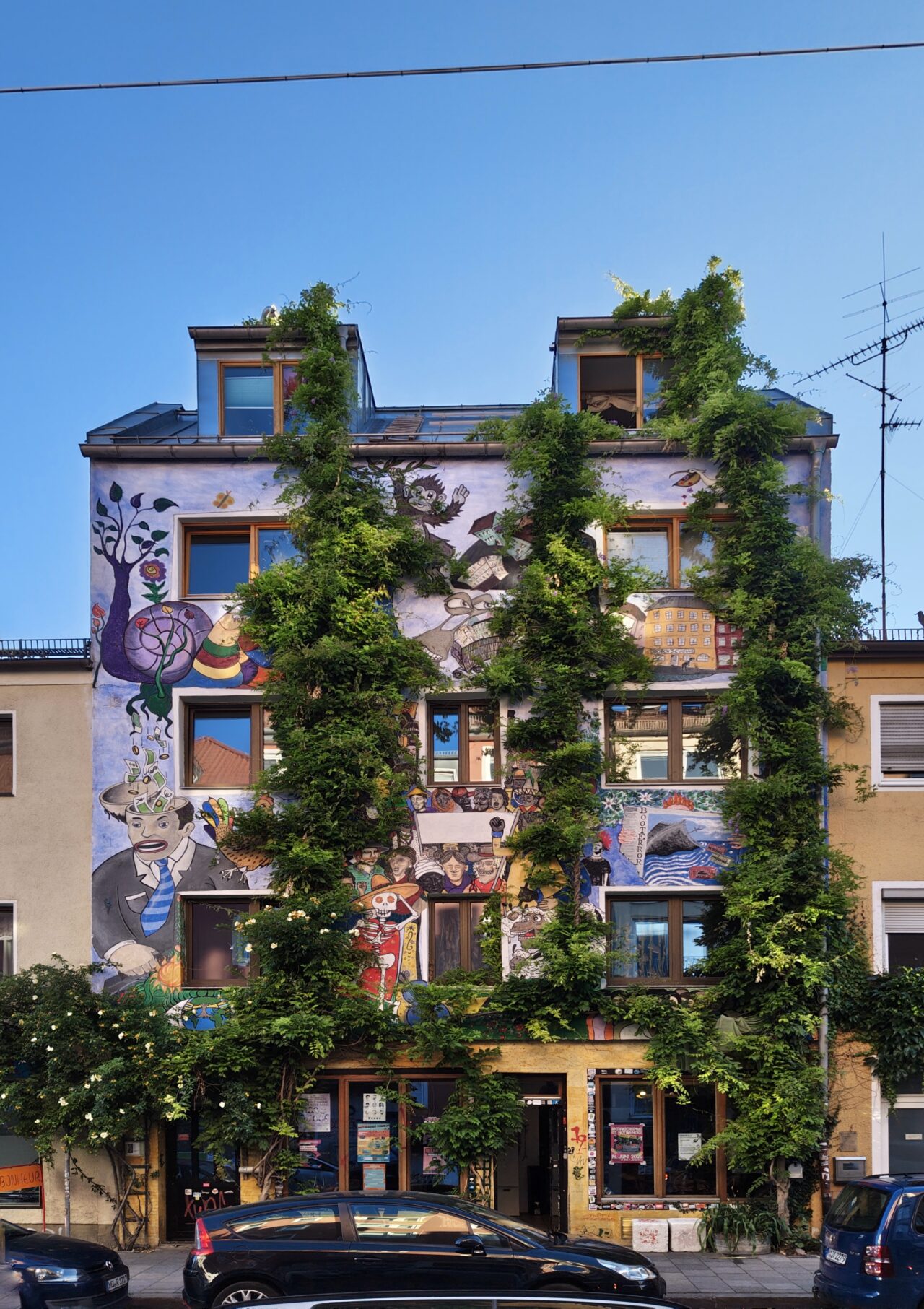 Grafittied house with foliage