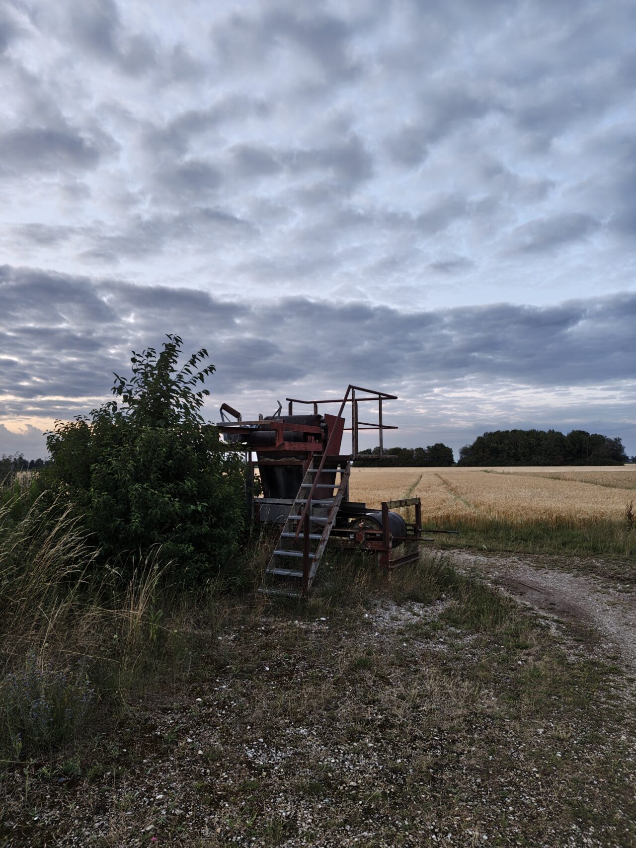 Rusted industrial parts on farmland