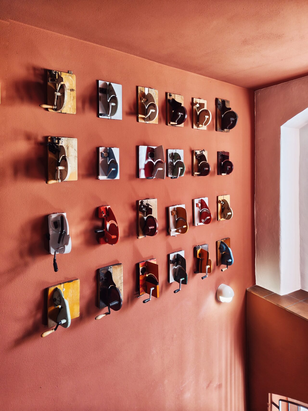 Assortment of Bred cutters on wall