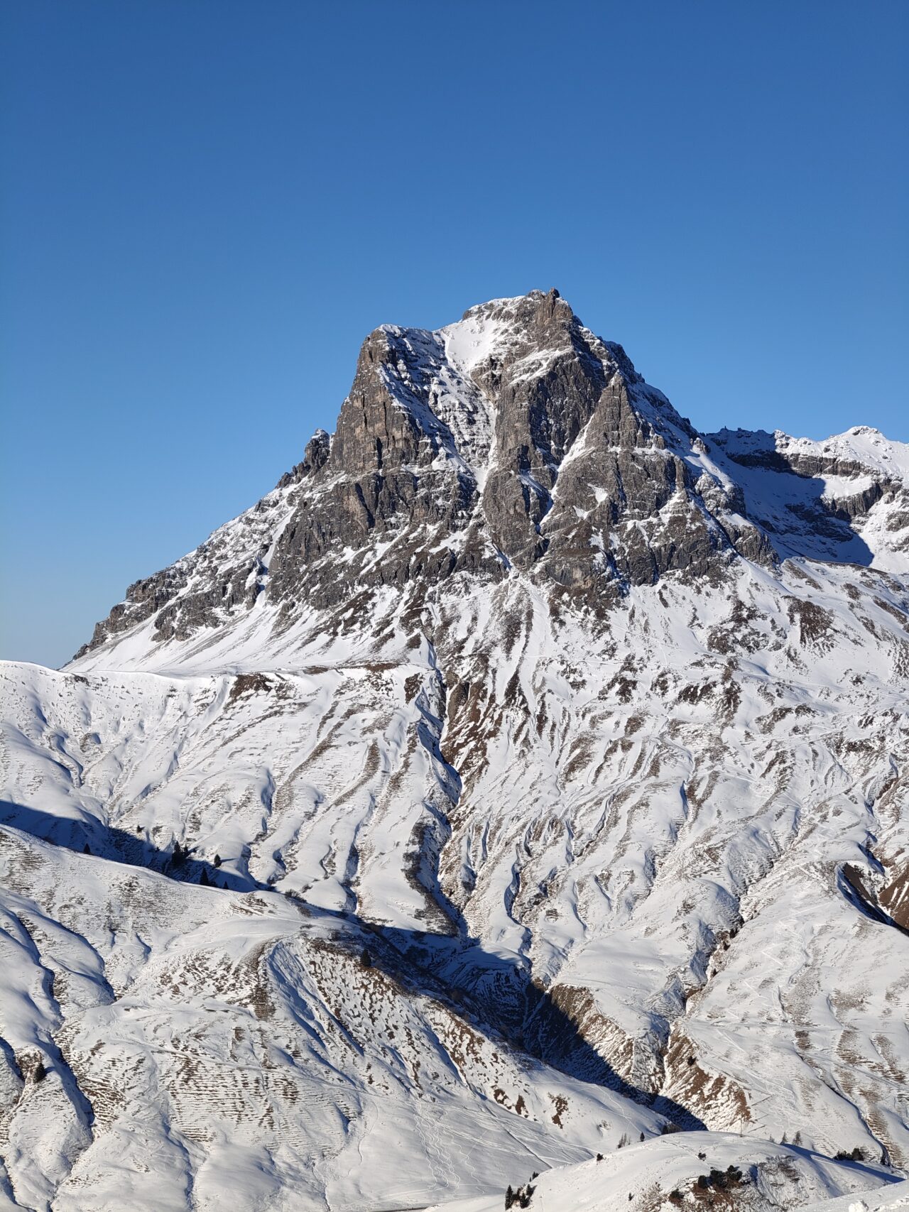 Snow-covered mountain with river valley