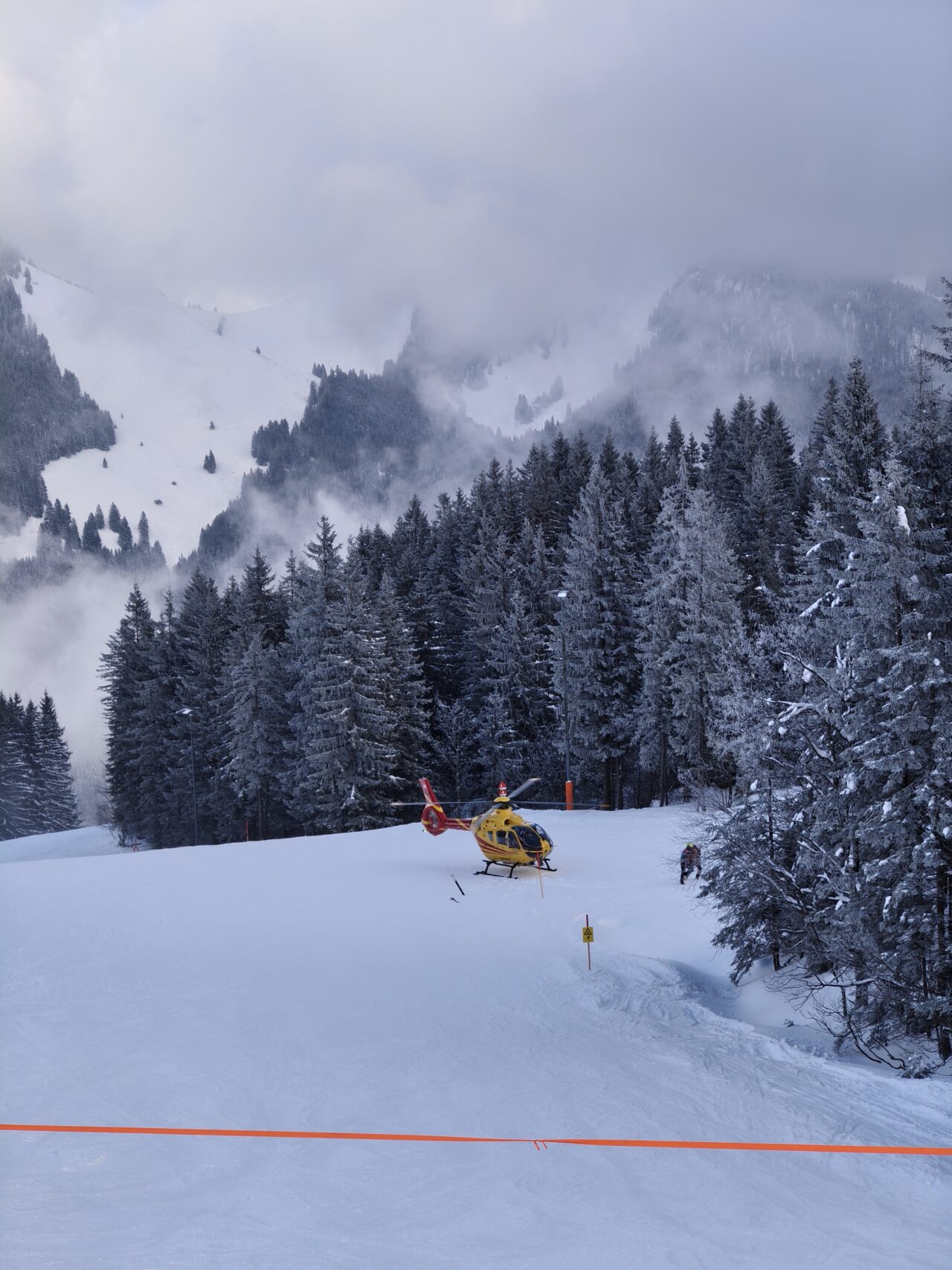 Helicopter rescuing skier