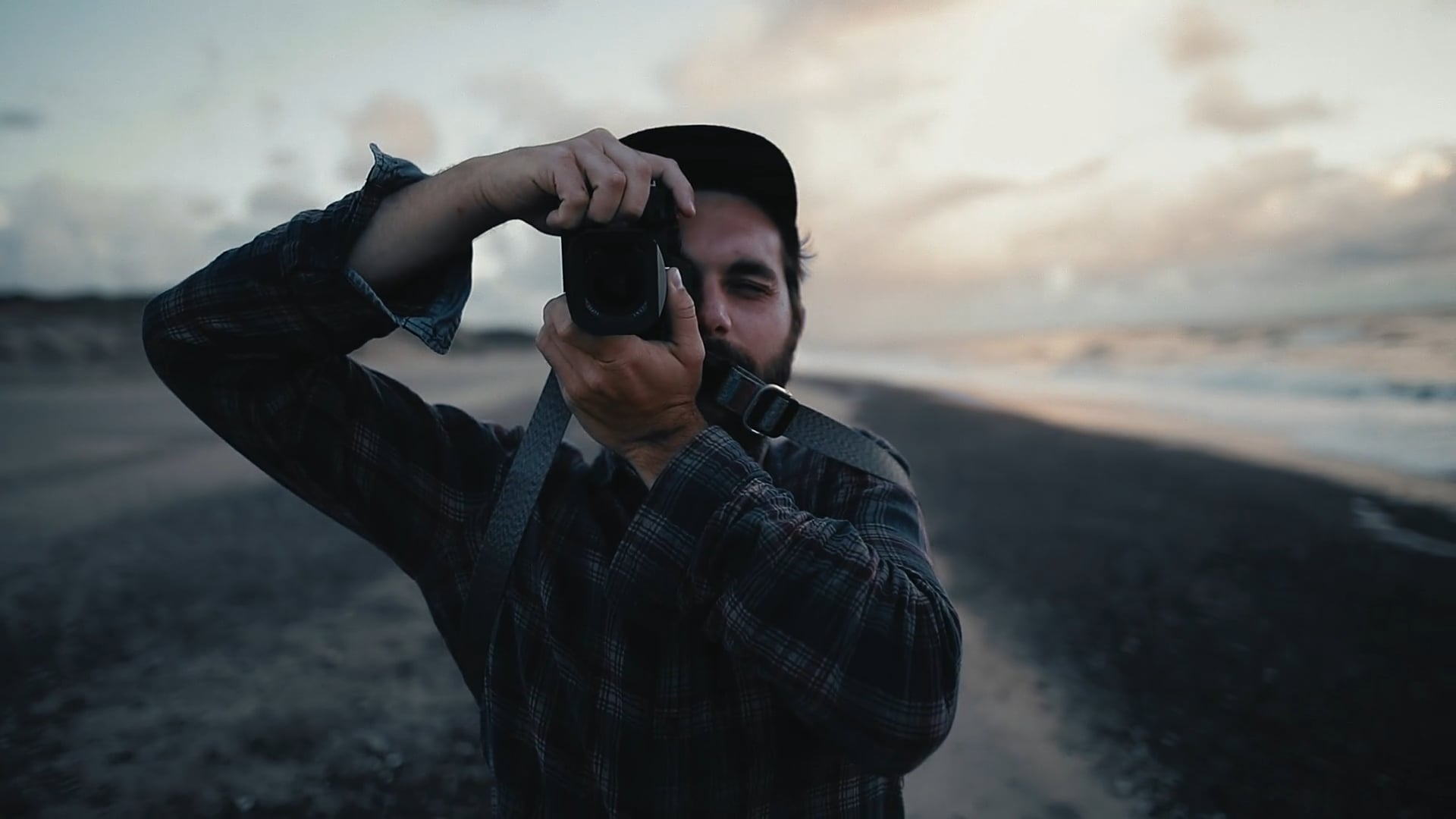 Jakob Teuffel holding camera on beach